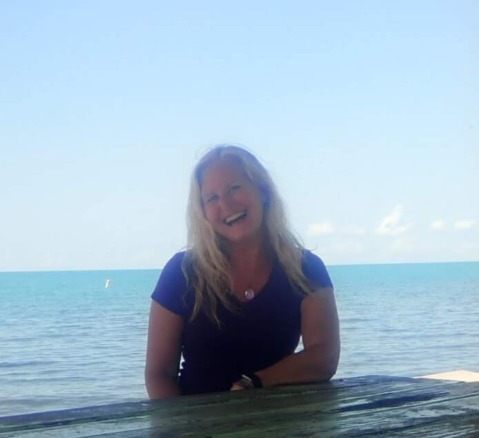 Jyll Hoyrup laughing in Belize — intuitive energy healer and coach